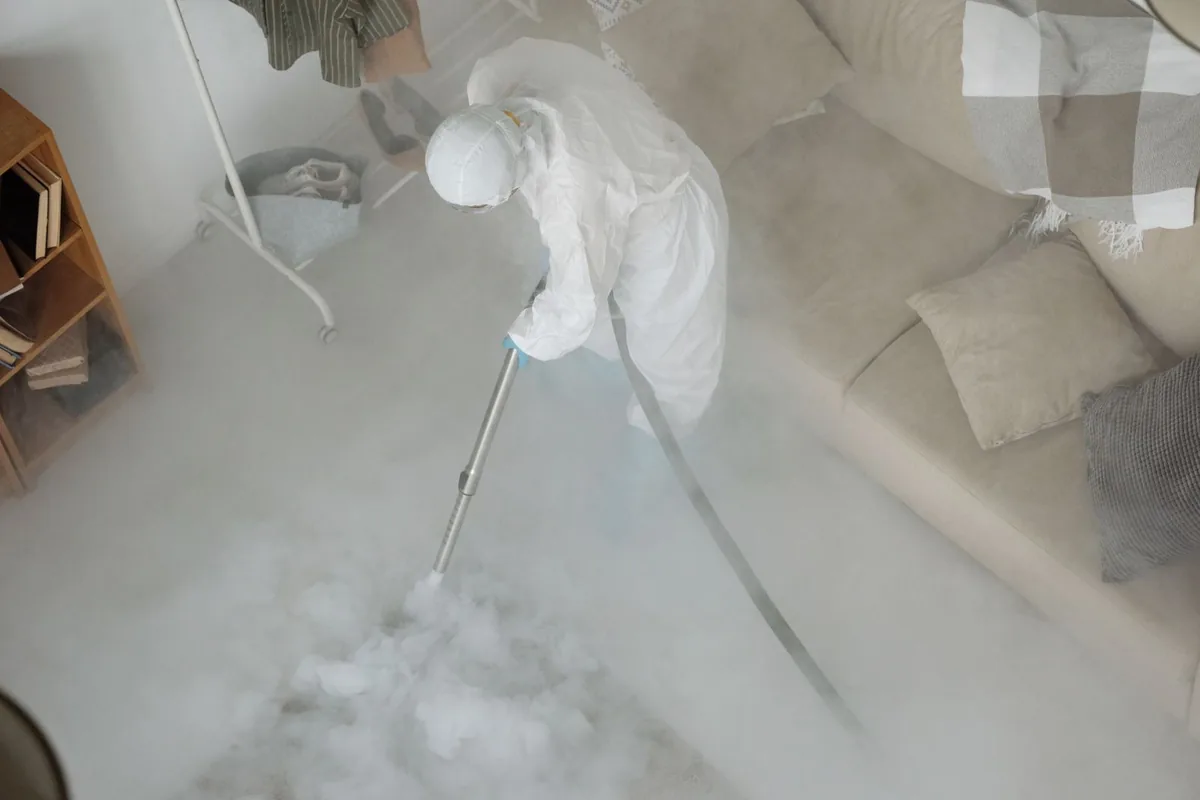 Biohazard cleanup technician in protective equipment, Dassel, MN